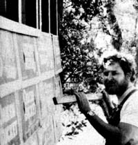 Dan Clancy works on the construction of his cardboard cabin.
